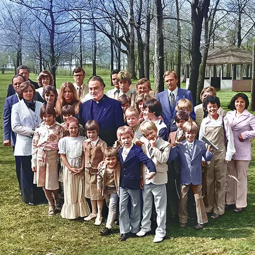 Brennan’s father with his seven surviving children and twenty-three grandchildren on the day he was ordained a Roman Catholic priest in 1977.
