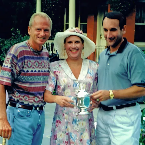 Friend and prankster Bob Green gets dolled up as a local socialite to surprise Brennan and present a faux trophy to Coach K after a Saratoga Wiffle ball game.