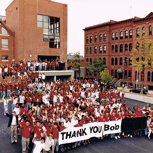 St. Benedict’s students thank Brennan for the HAB (in background) in 1988.