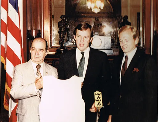 Senator Chris Jackman and New Jersey Governor Tom Kean celebrate Brennan’s bulletproof vest gift in 1982.
