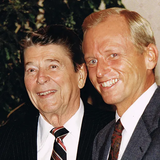 President Ronald Reagan and Brennan are all smiles in 1988.