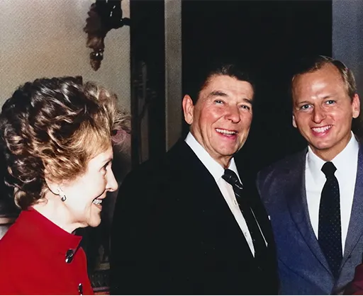 Nancy Reagan and the President welcome Brennan back to the White House in 1985.