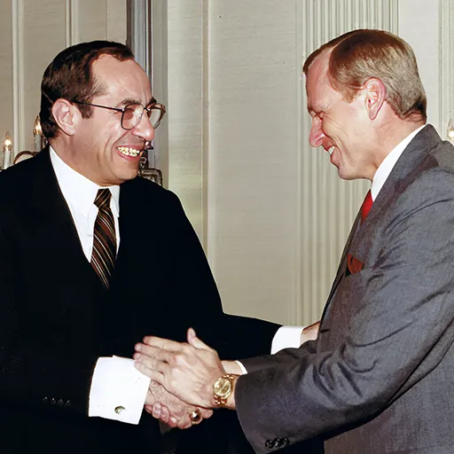New York Governor Mario Cuomo and Brennan congratulate each other as co-keynote speakers at a New York horseman’s convention in 1985.